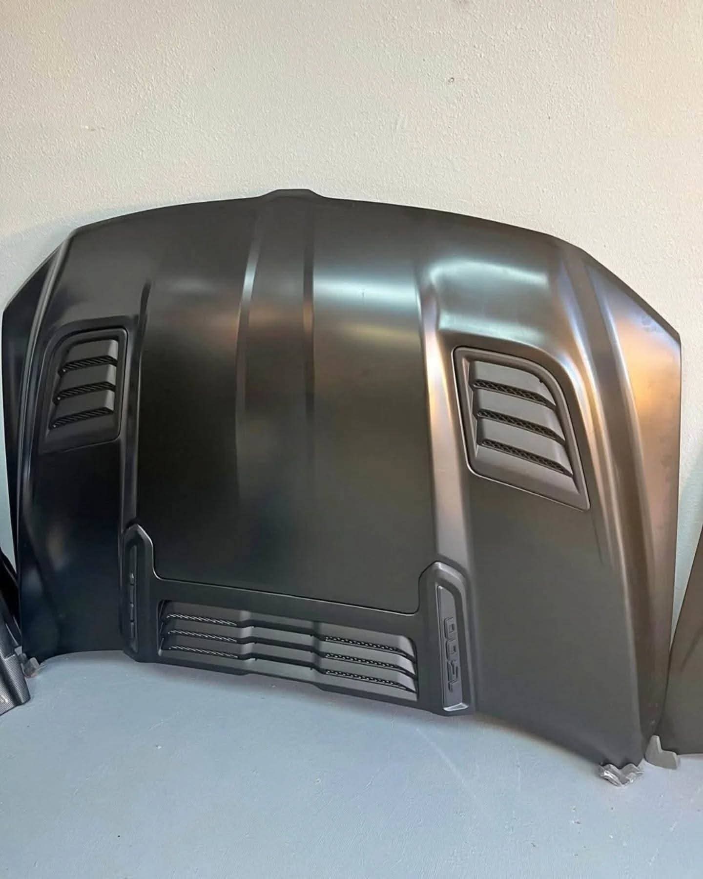 WhatsApp Image 2026-07-18 at 10.46.35 PM 2019–2024 Dodge Ram 1500 TRX Style Matte Black Hood with Performance Air Vents OEM Style Replacement