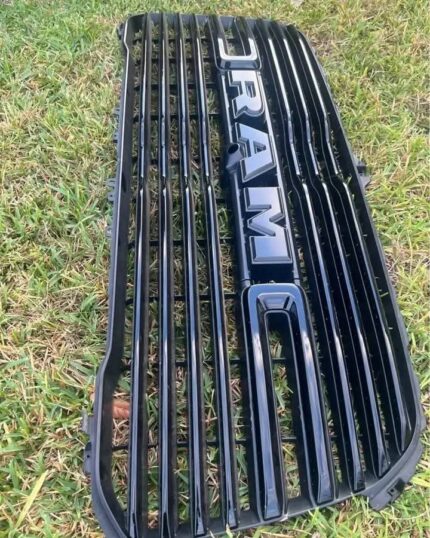Glossy black RAM 1500 front grille with large integrated RAM lettering